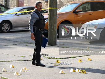 Shell casings are being located at the crime scene. A 34-year-old male victim is being shot multiple times and killed in Chicago, Illinois,...