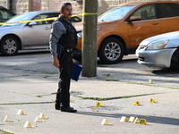 Shell casings are being located at the crime scene. A 34-year-old male victim is being shot multiple times and killed in Chicago, Illinois,...