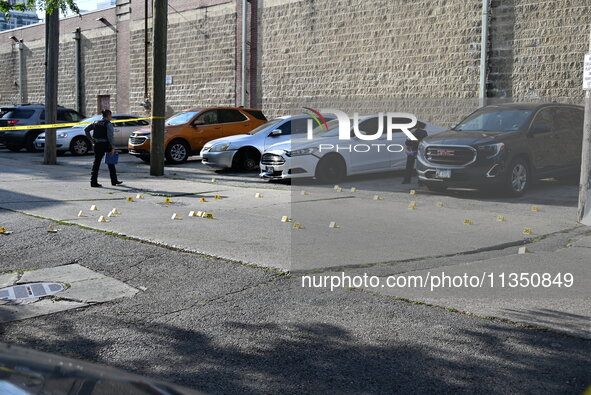 Shell casings are being located at the crime scene. A 34-year-old male victim is being shot multiple times and killed in Chicago, Illinois,...