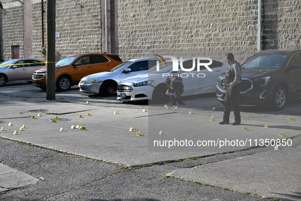 Shell casings are being located at the crime scene. A 34-year-old male victim is being shot multiple times and killed in Chicago, Illinois,...