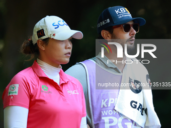 Ariya Jutanugarn of Thailand looks down the fairway with her caddie during the second round of the KPMG Women's PGA Championship at Sahalee...