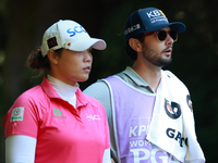 Ariya Jutanugarn of Thailand looks down the fairway with her caddie during the second round of the KPMG Women's PGA Championship at Sahalee...