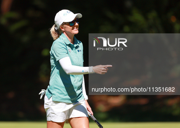 Sarah Kemp of Australia gestures to her caddie after putting on the 15th green during the second round of the KPMG Women's PGA Championship...