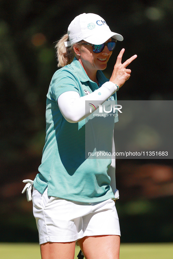 Sarah Kemp of Australia gestures to her caddie after putting on the 15th green during the second round of the KPMG Women's PGA Championship...