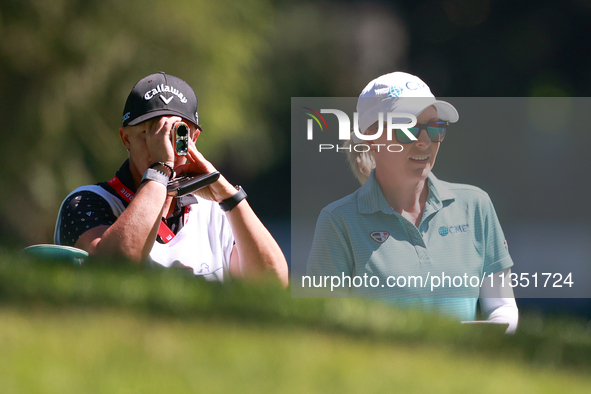 Sarah Kemp of Australia looks down the 18th fairway with her caddie during the second round of the KPMG Women's PGA Championship at Sahalee...