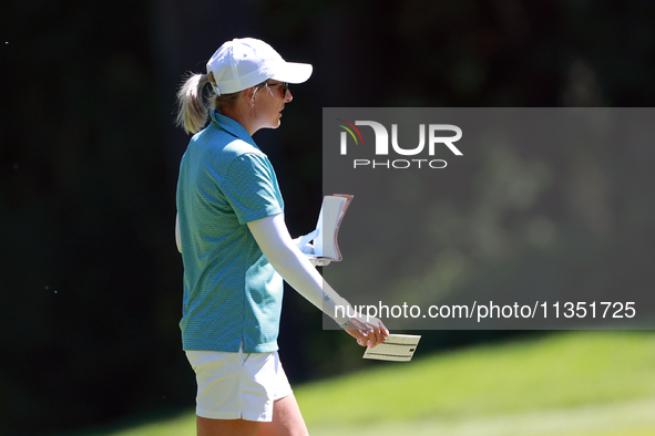 Sarah Kemp of Australia walks on the 18th fairway during the second round of the KPMG Women's PGA Championship at Sahalee Country Club on Fr...