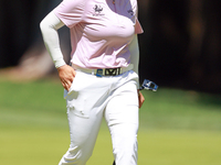 Ruoning Yin of China walks on the 2nd green with her caddie during the second round of the KPMG Women's PGA Championship at Sahalee Country...