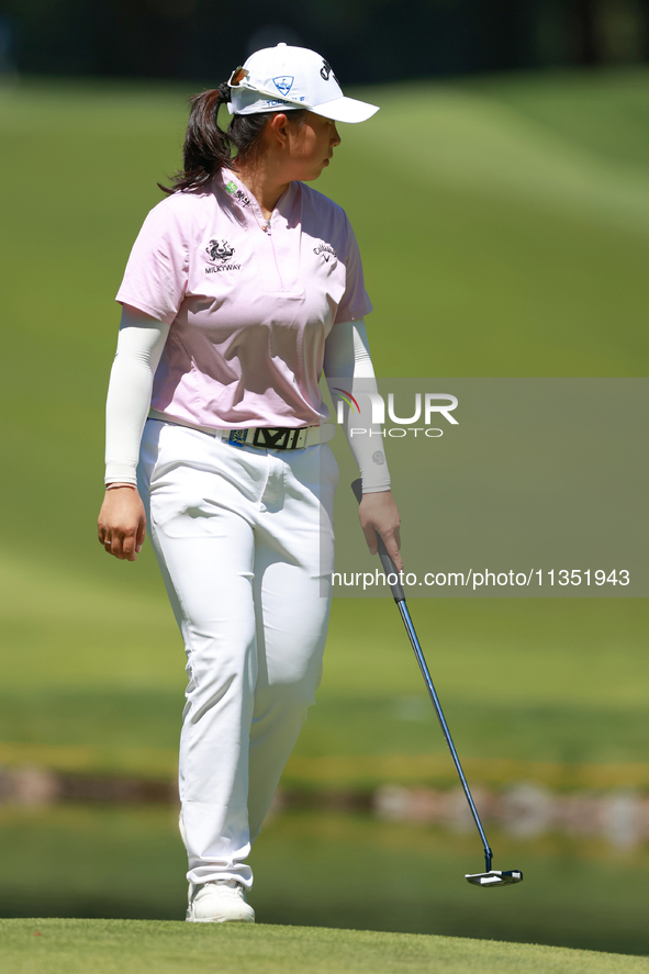 Ruoning Yin of China looks over the 2nd green during the second round of the KPMG Women's PGA Championship at Sahalee Country Club on Friday...