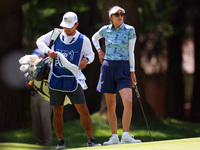 Alison Lee of Los Angeles, California waits with her caddie on the 6th green during the second round of the KPMG Women's PGA Championship at...