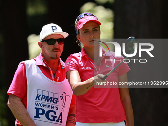 Lexi Thompson of the United States interacts with her caddy on the third hole during Day Three of the KPMG Women's PGA Championship at Sahal...