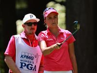 Lexi Thompson of the United States interacts with her caddy on the third hole during Day Three of the KPMG Women's PGA Championship at Sahal...