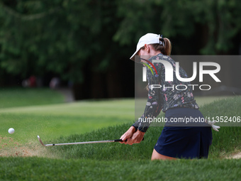 Sarah Schmelzel of the United States hits out of the bunker on the 6th green during Day Three of the KPMG Women's PGA Championship at Sahale...