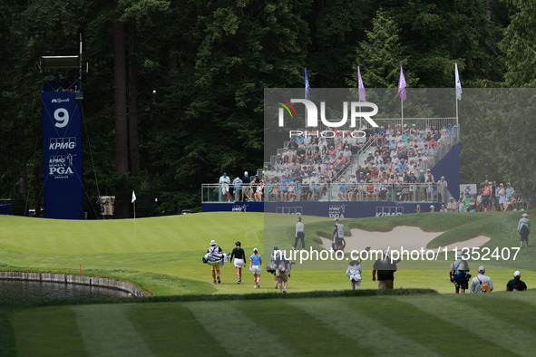 Madelene Sagstrom of Sweden (L), Leone Maguire of Ireland (center) and Miyu Yamashita of Japan (R) approach the 9th green during Day Three o...