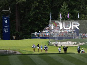 Madelene Sagstrom of Sweden (L), Leone Maguire of Ireland (center) and Miyu Yamashita of Japan (R) approach the 9th green during Day Three o...