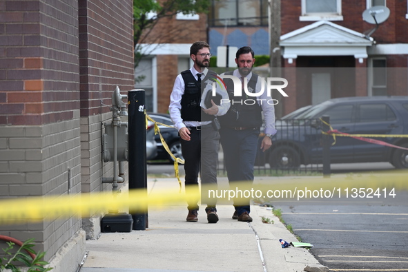 Chicago police officers are canvassing the area and searching for clues. A 49-year-old man is being shot and killed outside Daniel J. Corker...