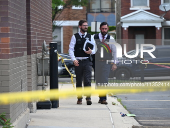 Chicago police officers are canvassing the area and searching for clues. A 49-year-old man is being shot and killed outside Daniel J. Corker...