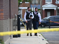 Chicago police officers are canvassing the area and searching for clues. A 49-year-old man is being shot and killed outside Daniel J. Corker...