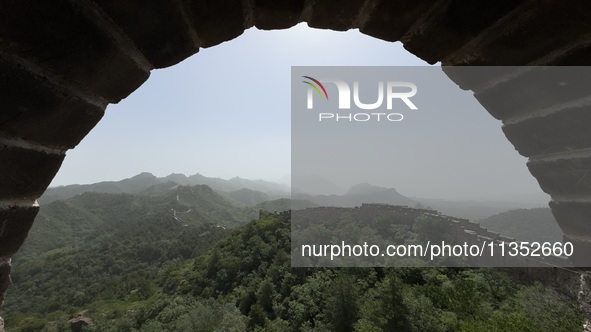 The Jinshanling Great Wall is being seen under sandstorm pollution in Chengde, China, on June 22, 2024. 