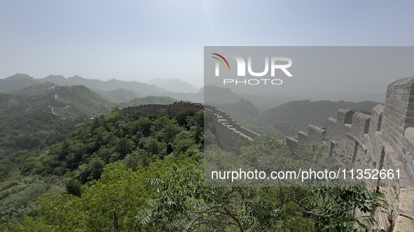 The Jinshanling Great Wall is being seen under sandstorm pollution in Chengde, China, on June 22, 2024. 