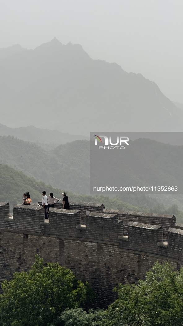 The Jinshanling Great Wall is being seen under sandstorm pollution in Chengde, China, on June 22, 2024. 