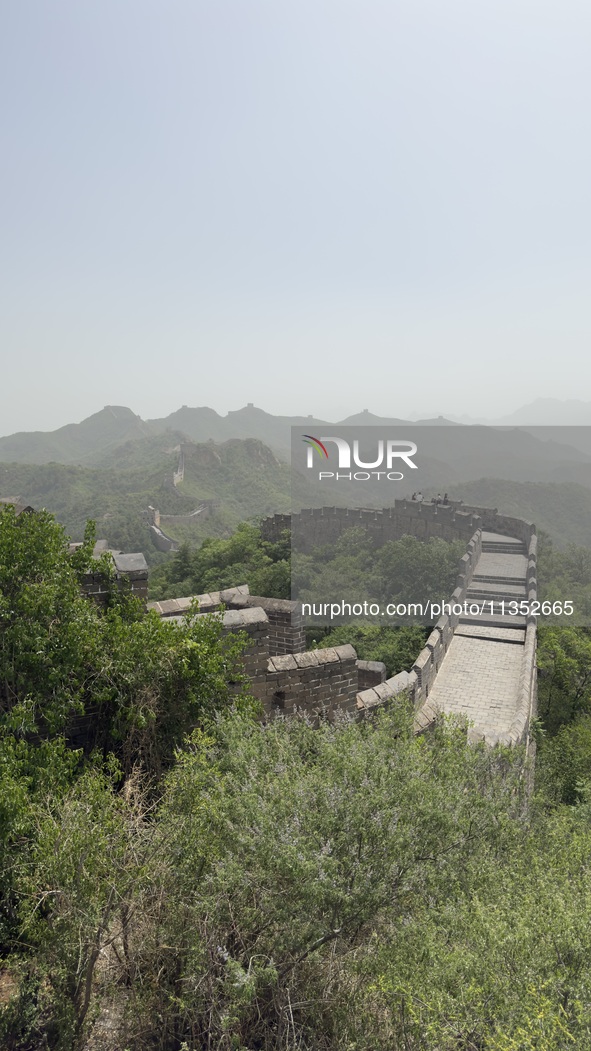 The Jinshanling Great Wall is being seen under sandstorm pollution in Chengde, China, on June 22, 2024. 