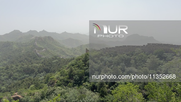 The Jinshanling Great Wall is being seen under sandstorm pollution in Chengde, China, on June 22, 2024. 