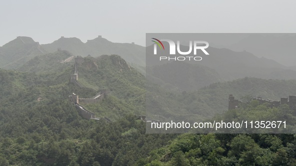 The Jinshanling Great Wall is being seen under sandstorm pollution in Chengde, China, on June 22, 2024. 