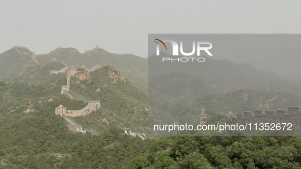 The Jinshanling Great Wall is being seen under sandstorm pollution in Chengde, China, on June 22, 2024. 