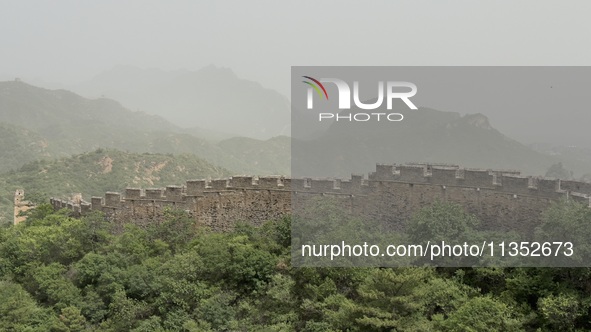 The Jinshanling Great Wall is being seen under sandstorm pollution in Chengde, China, on June 22, 2024. 