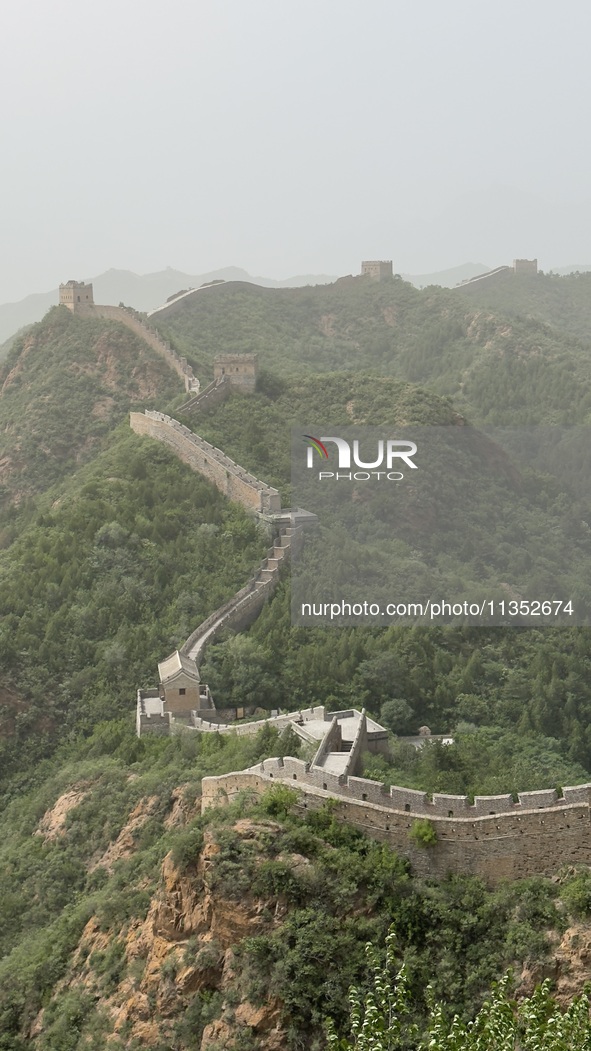 The Jinshanling Great Wall is being seen under sandstorm pollution in Chengde, China, on June 22, 2024. 