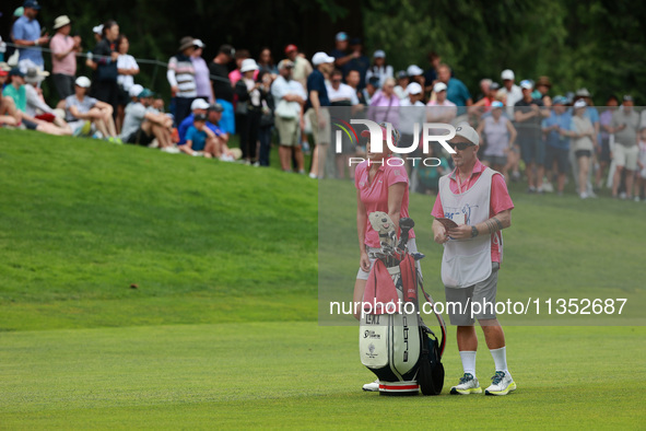 Lexi Thompson of the United States interacts with her caddy on the 18th hole during Day Three of the KPMG Women's PGA Championship at Sahale...