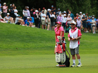 Lexi Thompson of the United States interacts with her caddy on the 18th hole during Day Three of the KPMG Women's PGA Championship at Sahale...