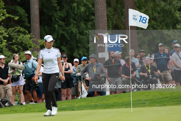 Hinako Shibuno of Japan looks over the 18th green during Day Three of the KPMG Women's PGA Championship at Sahalee Country Club in Sammamish...