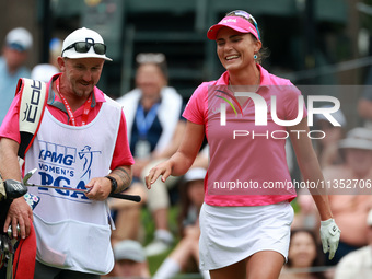 Lexi Thompson of Florida reacts to her shot from the 17th tee as her caddie takes her club during the third round of the KPMG Women's PGA Ch...