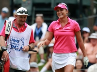 Lexi Thompson of Florida reacts to her shot from the 17th tee as her caddie takes her club during the third round of the KPMG Women's PGA Ch...