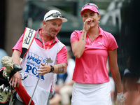 Lexi Thompson of Florida reacts to her shot from the 17th tee while walking with her caddie during the third round of the KPMG Women's PGA C...