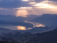 A golden sunrise is being seen over the Three Gorges Dam area in Yichang, China, on June 23, 2024, in the early morning. (