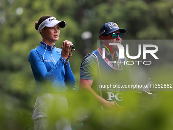 Esther Henseleit of Germany looks through a range finder on the 11th hole during Day Three of the KPMG Women's PGA Championship at Sahalee C...