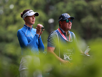 Esther Henseleit of Germany looks through a range finder on the 11th hole during Day Three of the KPMG Women's PGA Championship at Sahalee C...