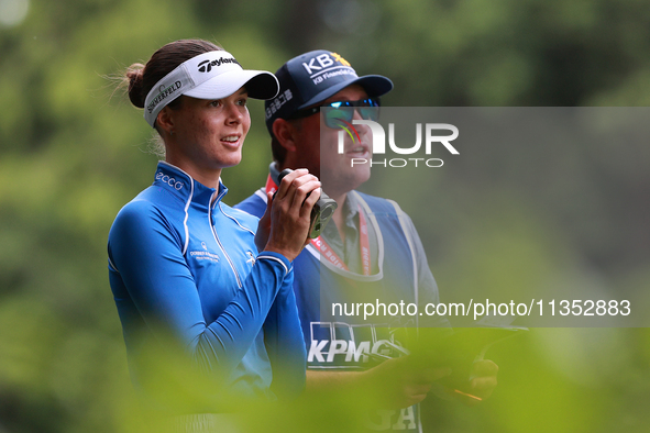 Esther Henseleit of Germany looks through a range finder on the 11th hole during Day Three of the KPMG Women's PGA Championship at Sahalee C...