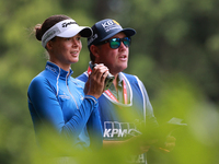 Esther Henseleit of Germany looks through a range finder on the 11th hole during Day Three of the KPMG Women's PGA Championship at Sahalee C...