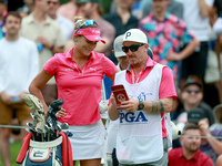 Lexi Thompson of Florida waits with her caddie at the 17th tee during the third round of the KPMG Women's PGA Championship at Sahalee Countr...