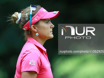 Lexi Thompson of Florida walks to the 16th green during the third round of the KPMG Women's PGA Championship at Sahalee Country Club on Satu...