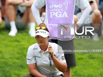 Haeran Ryu of Republic of Korea lines up her putt with her caddie on the 16th green during the third round of the KPMG Women's PGA Champions...