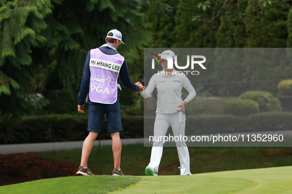 Mi Hyang Lee of Republic of Korea interact with her caddie on the 10ht green during Day Three of the KPMG Women's PGA Championship at Sahale...