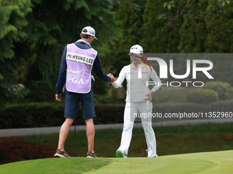 Mi Hyang Lee of Republic of Korea interact with her caddie on the 10ht green during Day Three of the KPMG Women's PGA Championship at Sahale...