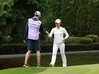 Mi Hyang Lee of Republic of Korea interact with her caddie on the 10ht green during Day Three of the KPMG Women's PGA Championship at Sahale...