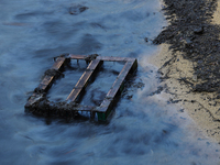 A general view is showing the oil sheen on the waters at East Coast Park beach in Singapore, on June 23, 2024. Singapore authorities are con...