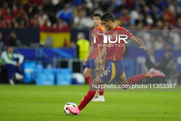 Rodrigo Hernandez defensive midfield of Spain and Manchester City during the UEFA EURO 2024 group stage match between Spain and Italy at Are...