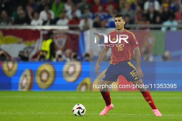 Rodrigo Hernandez defensive midfield of Spain and Manchester City during the UEFA EURO 2024 group stage match between Spain and Italy at Are...